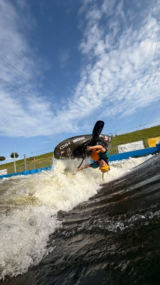 Bartosz Czauderna paddling K1 at the Kraków-Kolna Canoe Slalom Course in Poland