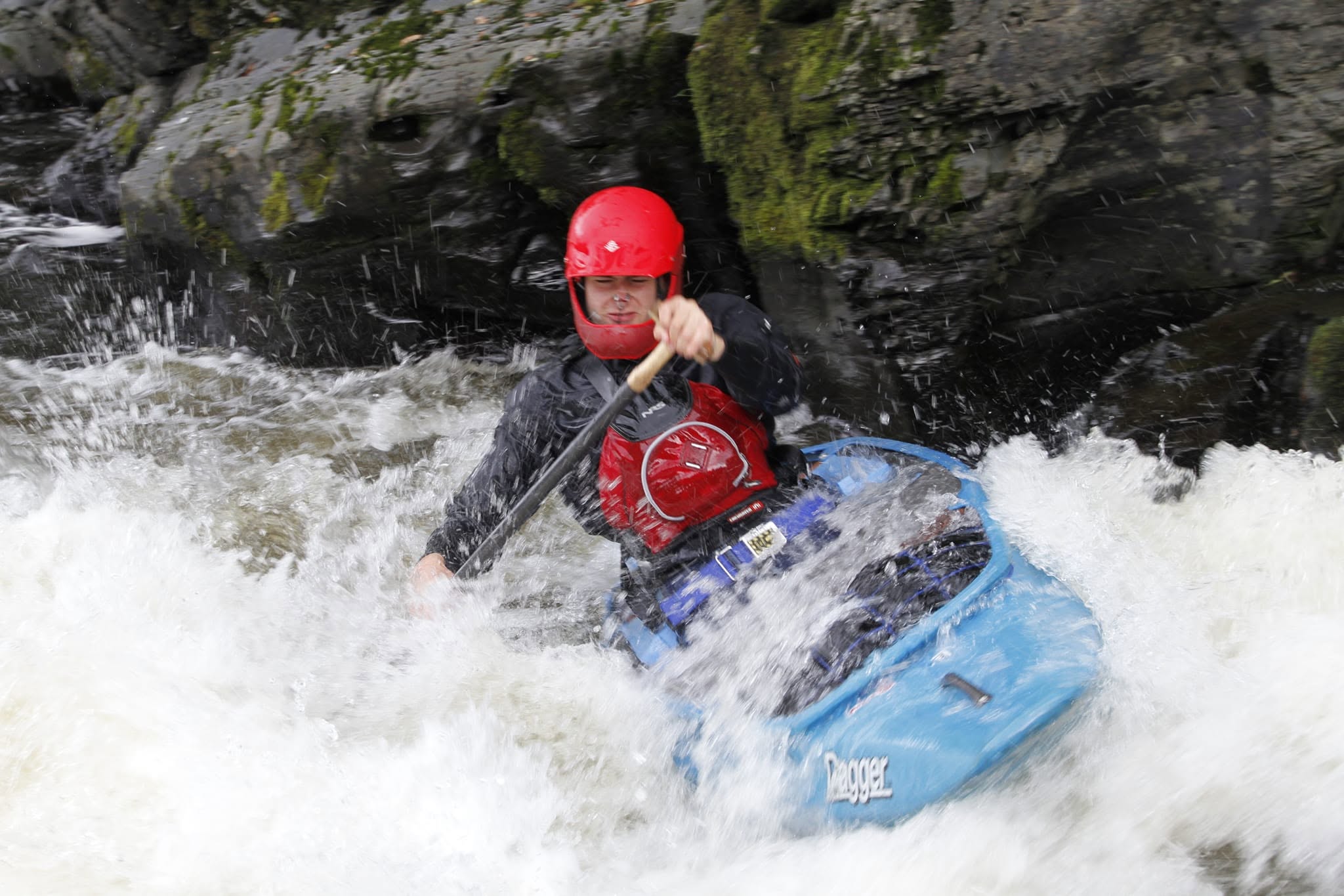 Harvey Harwood river running in a Dagger Aftershock open canoe