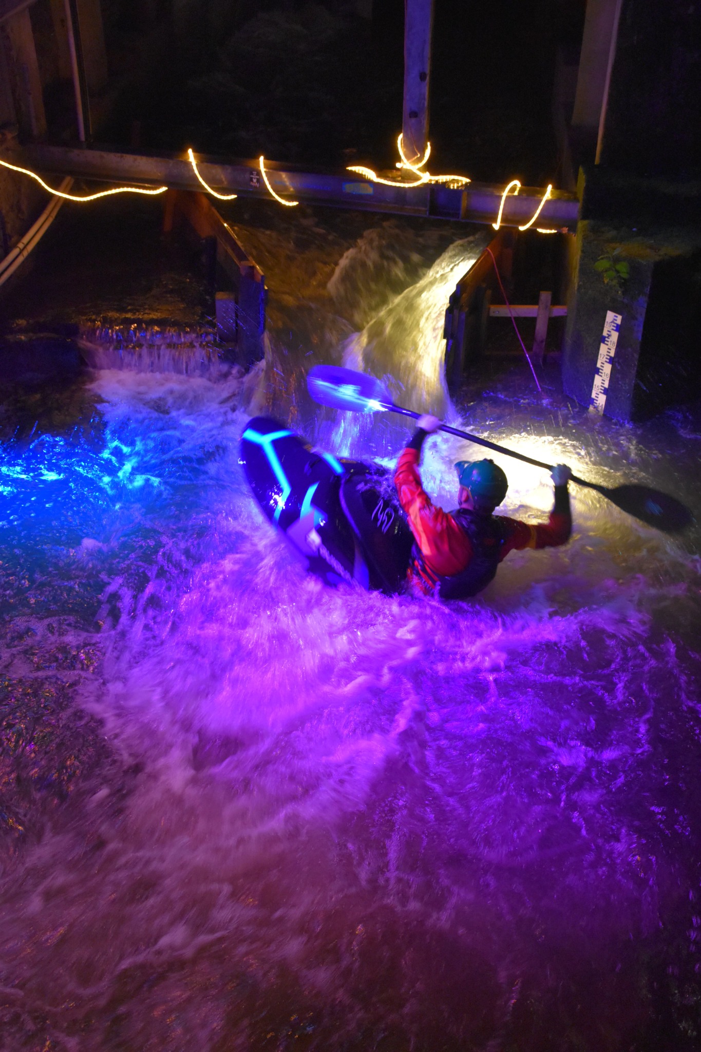 K1 paddler at the illuminated Limburg Mill Wave in Germany