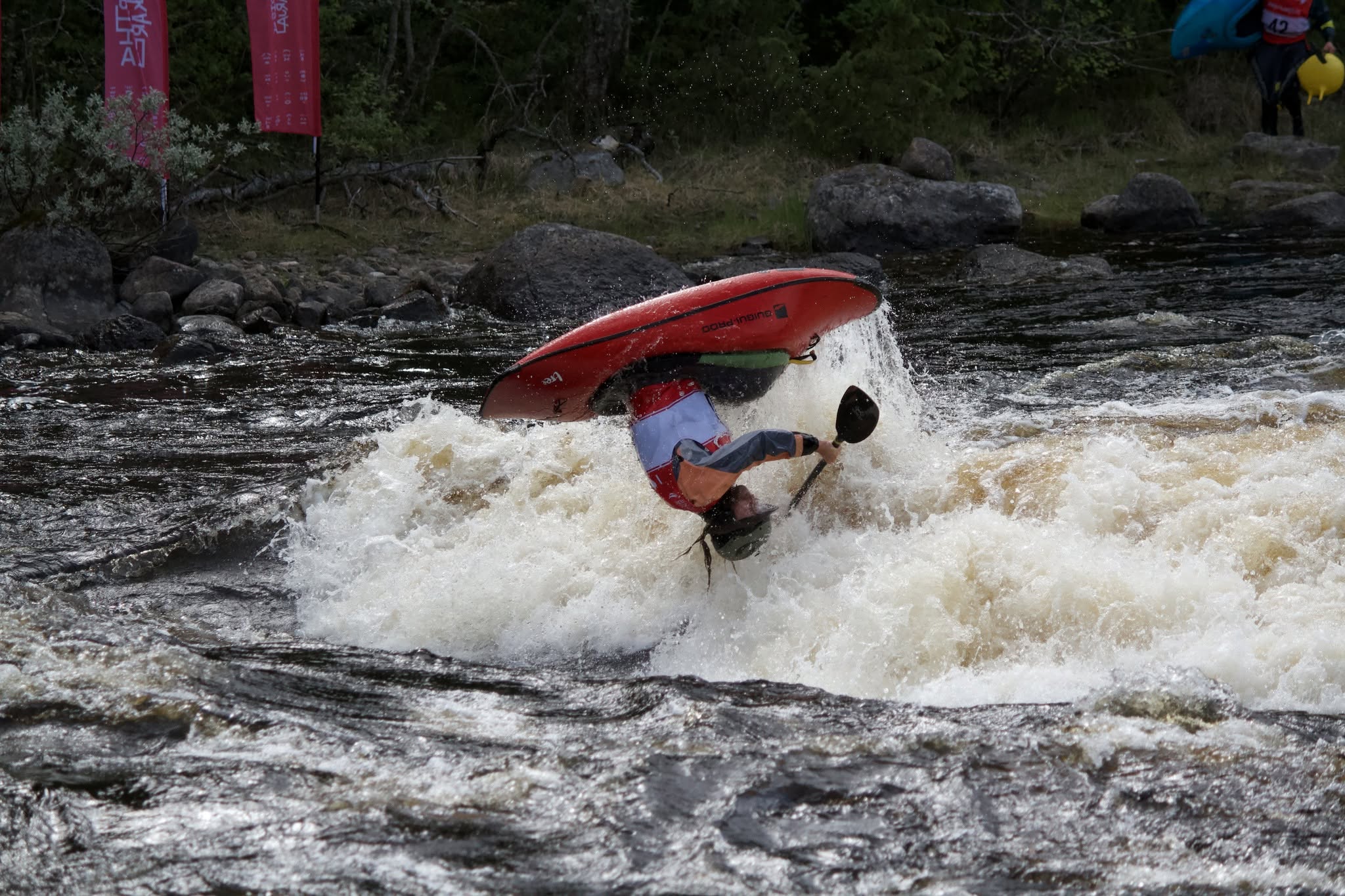 Matt Stephenson paddling C1 at Neitikoski Rapid in Lieksa, Finland