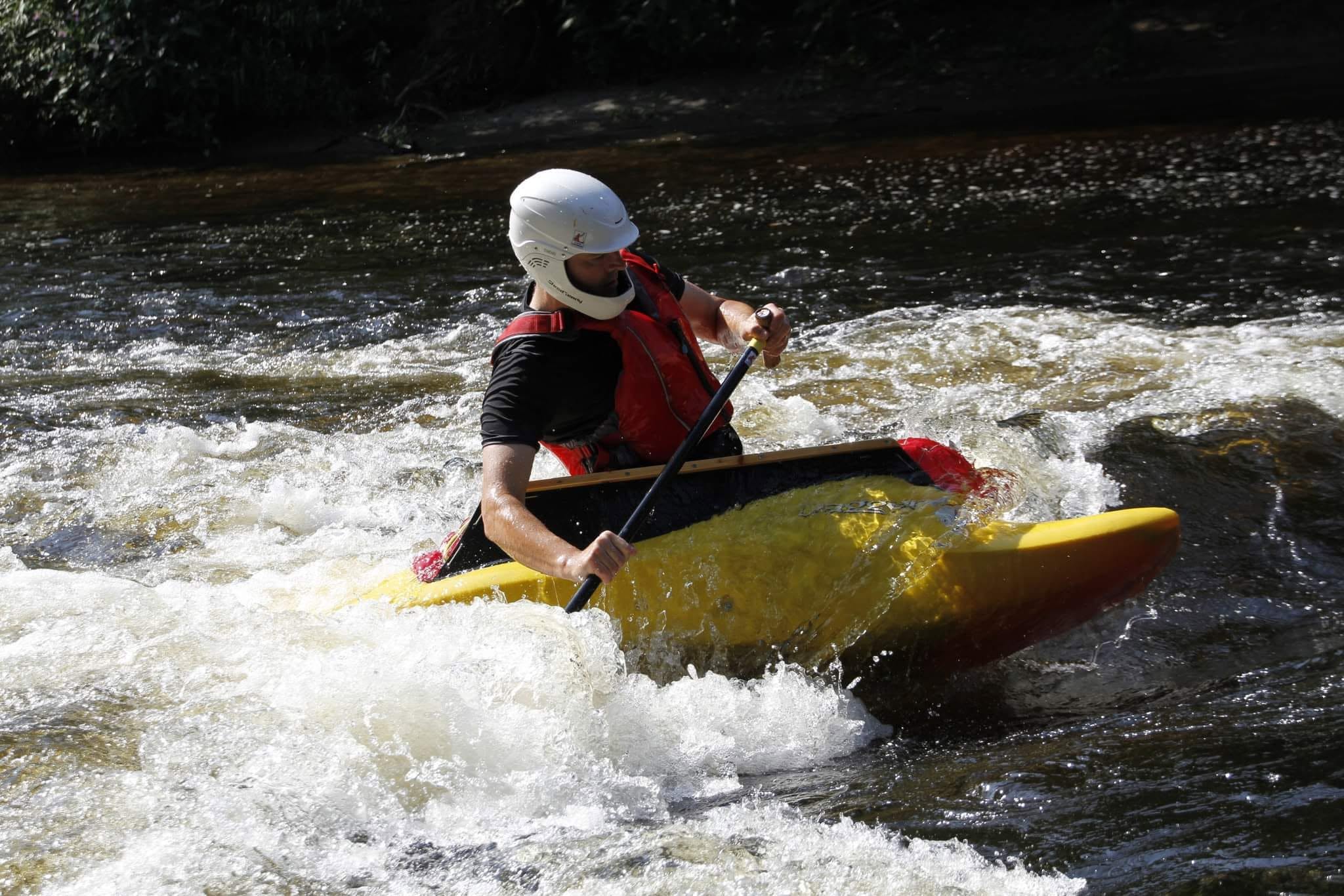 Paul Harwood paddling a Dagger Kingpin OC1 at Llangollen